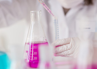 close up of scientist making test in lab