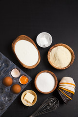 baking ingredients on dark. yogurt, semolina, eggs & butter. kit
