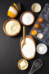 baking ingredients on dark. yogurt, semolina, eggs & butter. kit