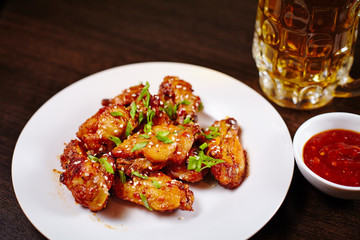 Chicken wings on white dish