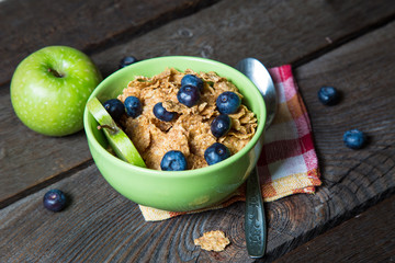 Healthy breakfast. Cereal with blueberries and apple
