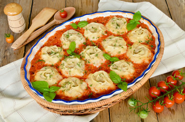Roll out the dough with minced meat in vegetable sauce