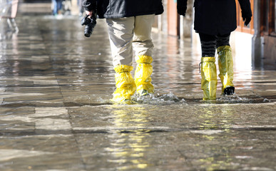 venice photographer with gaiters at high tide