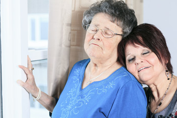 A senior grandmother with is daughter having great time in room