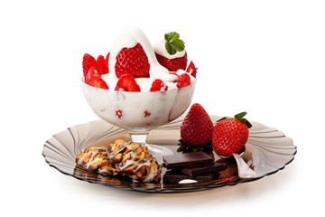 strawberries with cream , cookies and chocolate
