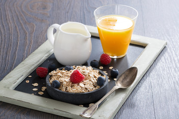 healthy food - cereal, fresh berries, milk and orange juice