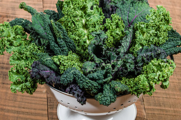 Red and green kale in colander - Powered by Adobe