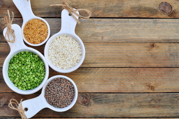 Different kinds of bean seeds on a wooden table