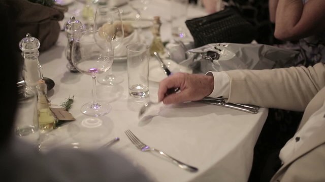 A man knocks spoon on the table