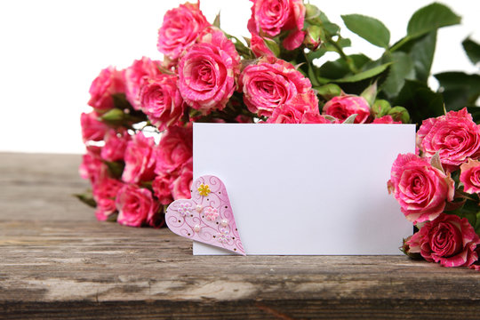 Bouquet of pink roses, heart  and greeting card
