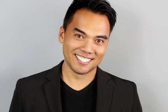 Young Filipino man smiling