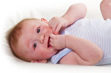 cute little baby boy laying and smiling