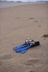 Fototapeta na wymiar snorkel equipment on a rocky beach