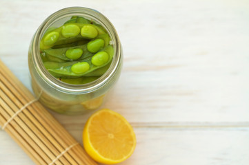 Edamame, soy beans on a vintage wooden background