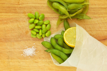 Edamame, soy beans on a wooden background