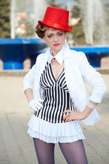 Circus artist woman in red hat