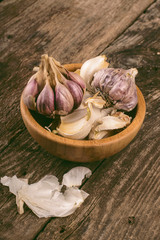Garlic cloves in wooden bowl