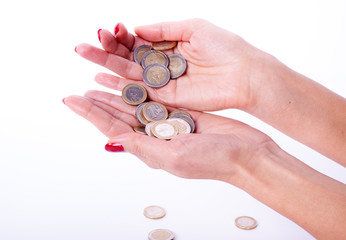 Female hand holding euro coin