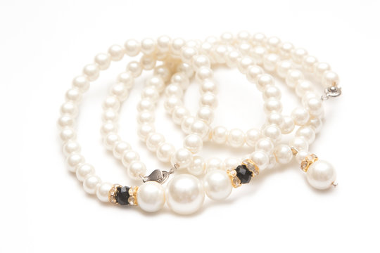 Beautiful pearl necklace on white