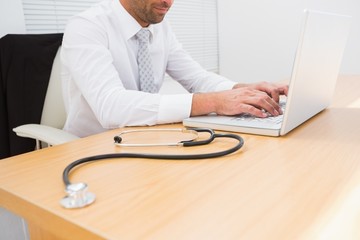 Businessman using his laptop