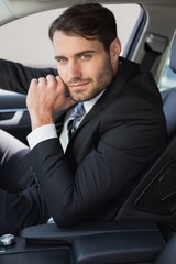 Businessman sitting in drivers seat