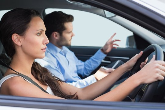 Young woman getting a driving lesson