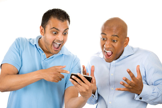 two men looking shocked with open mouth on cell mobile  phone