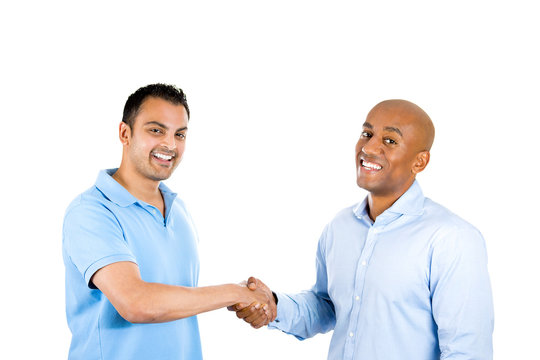 two cheerful man handshaking smiling 