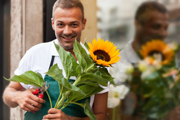 Portrait of florist next to his shop