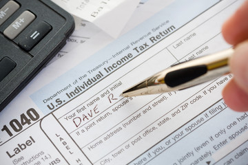 Naklejka na ściany i meble Taxes: Writing Name on 1040 Tax Return