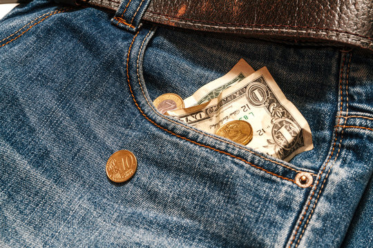 $ 2and coins in your pocket jeans.Crisis, poverty concept