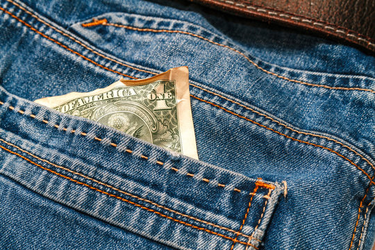 One crumpled dollar in your pocket jeans.Crisis, poverty concept