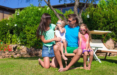 Fototapeta premium Happy family of four during summer vacation