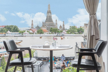 Riverside seats and tables near Chaophraya river in Bangkok, Tha