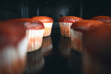 Muffins in the oven - 78083337