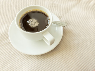 cup of coffee on old white table
