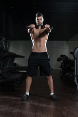 Fototapeta na wymiar Dumbbell Squat Workout For Legs