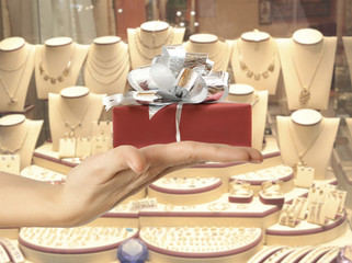 Female hand holding a gift