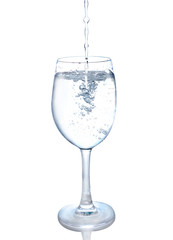 splashing water wave in the wine glass on white background