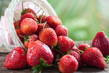 Red strawberry in basket with nature background