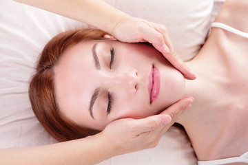 Fototapeta na wymiar young woman enjoy face massage