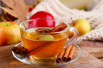 Composition of  apple cider with cinnamon sticks, fresh apples,