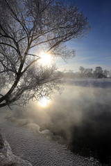 Obraz na płótnie Canvas fog over winter river