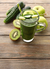 Green fresh healthy juice with fruits and vegetables