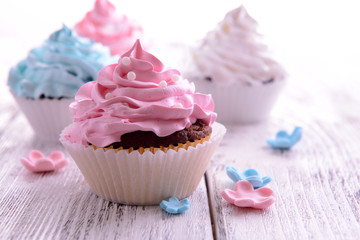 Delicious cupcakes on table close-up