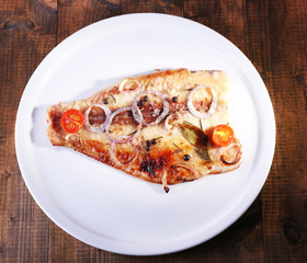 Dish of Pangasius fillet with spices and vegetables