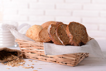 Tasty bread on table on light background