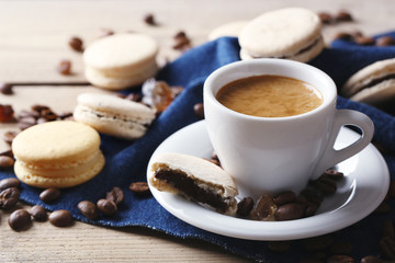 Gentle colorful macaroons and  coffee in mug