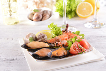 Tasty seafood on plate on table close-up