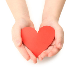 Fototapeta premium Heart in child hands isolated on white
